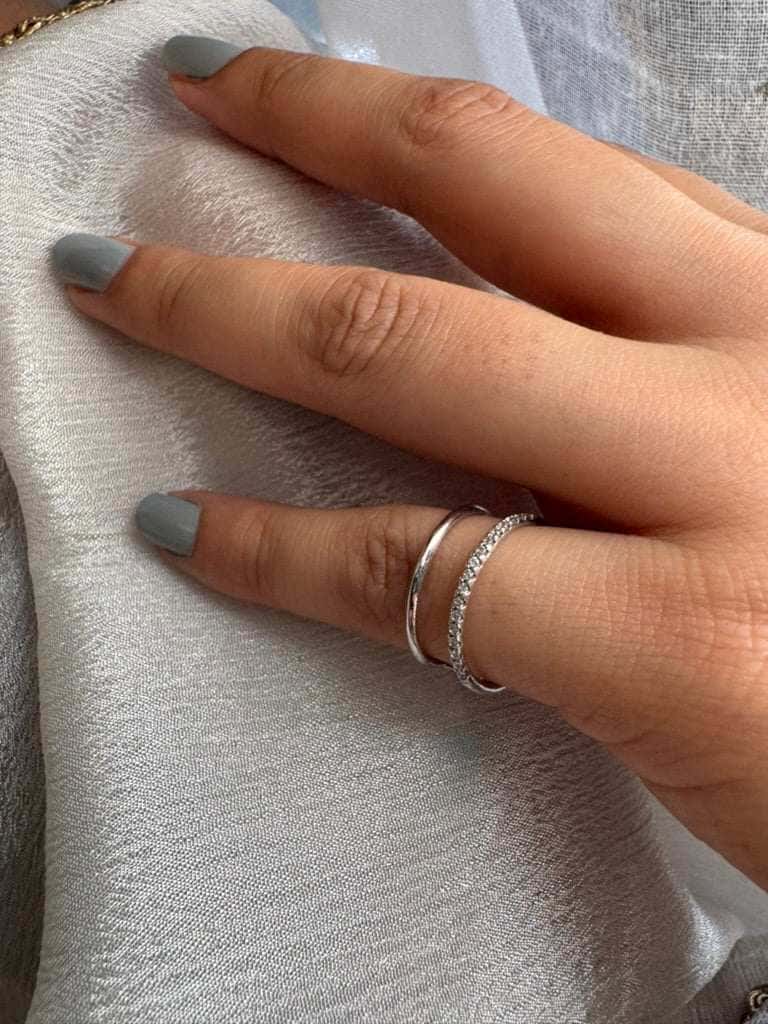 Curve Layer Ring on hand, showcasing elegant design.