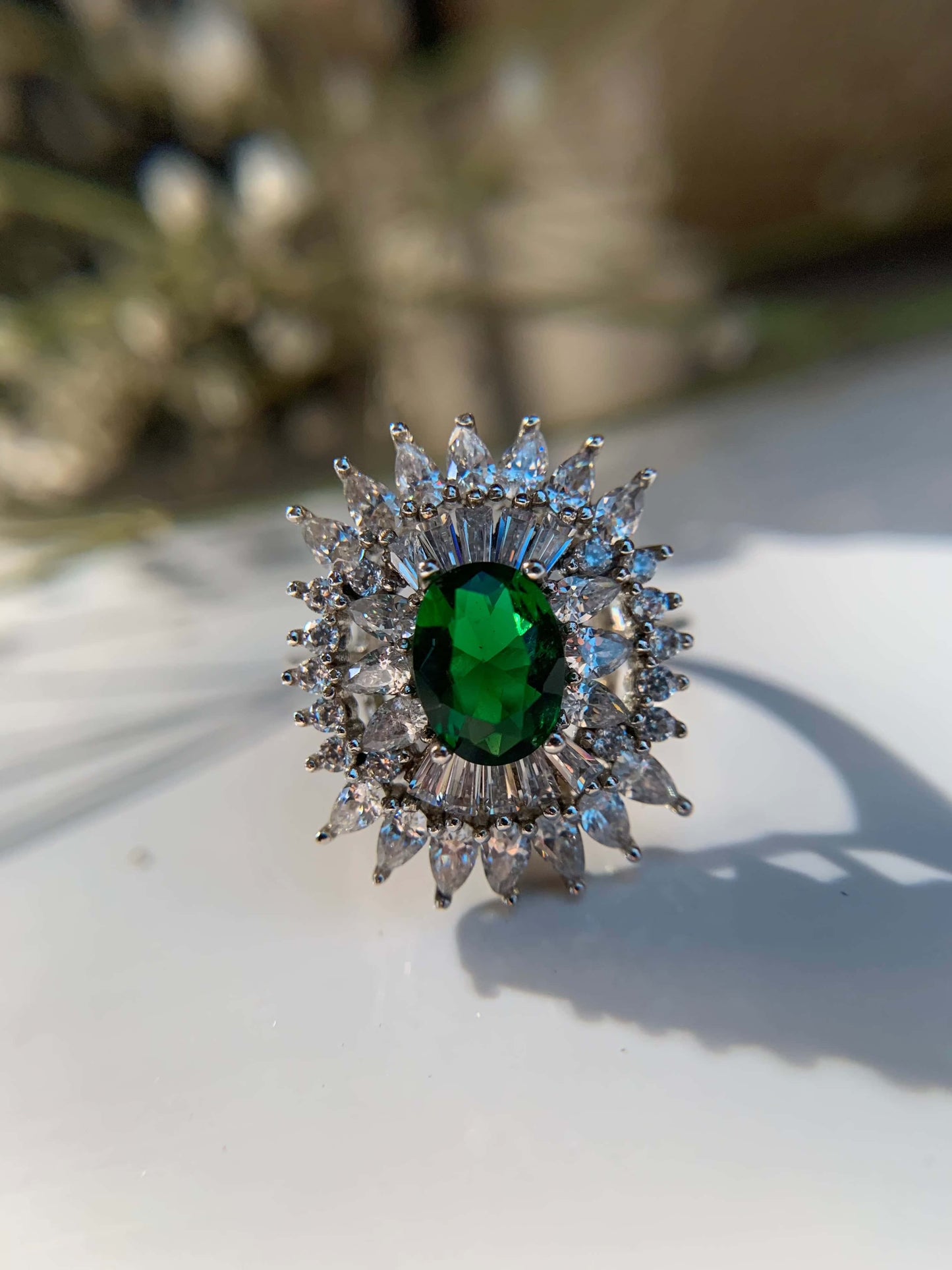 Green Cocktail Ring with Emerald Stone Surrounded by Diamonds