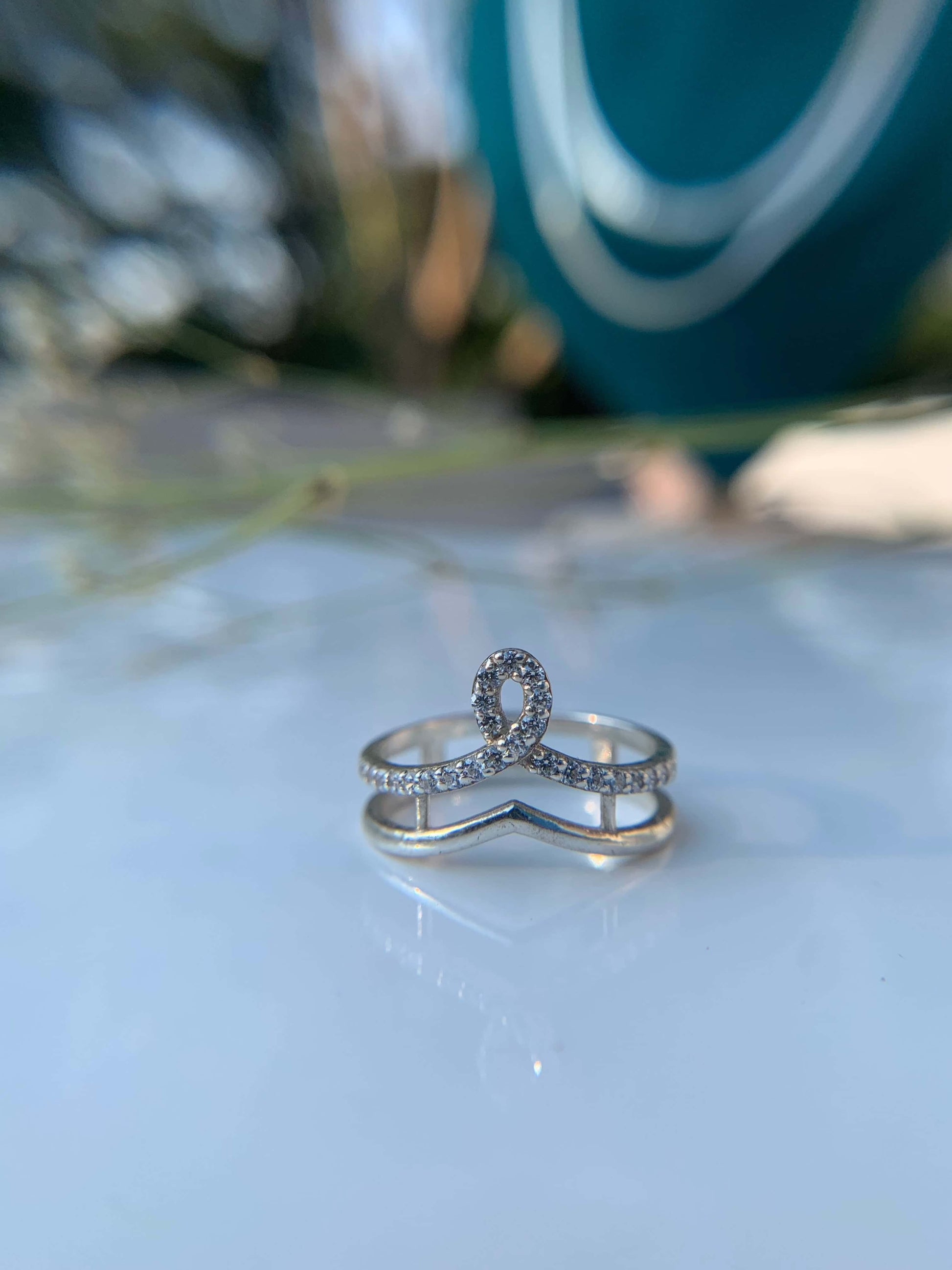 Crown Ring with sparkling design on white background.