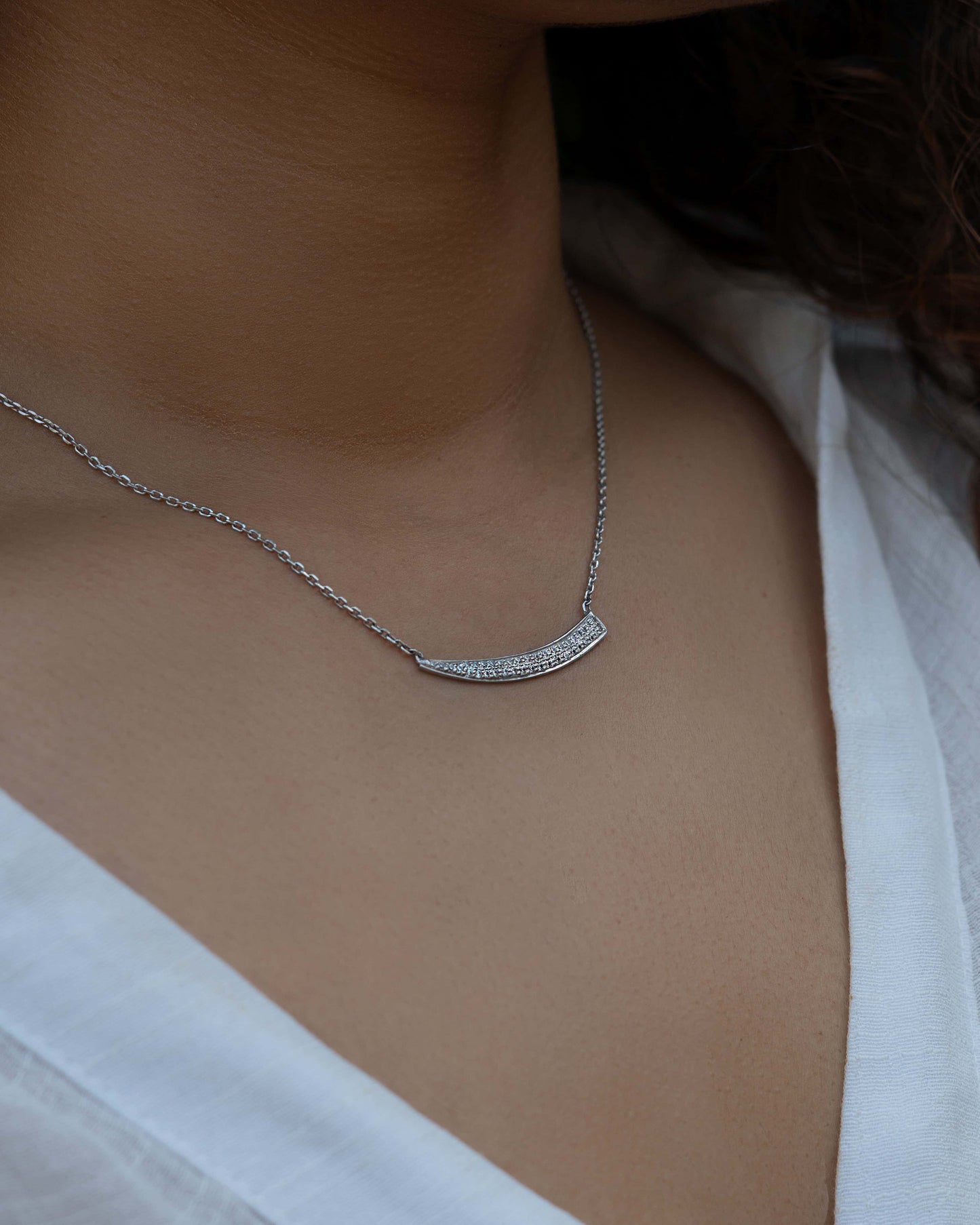 Silver Sward Pendant necklace on woman's neck