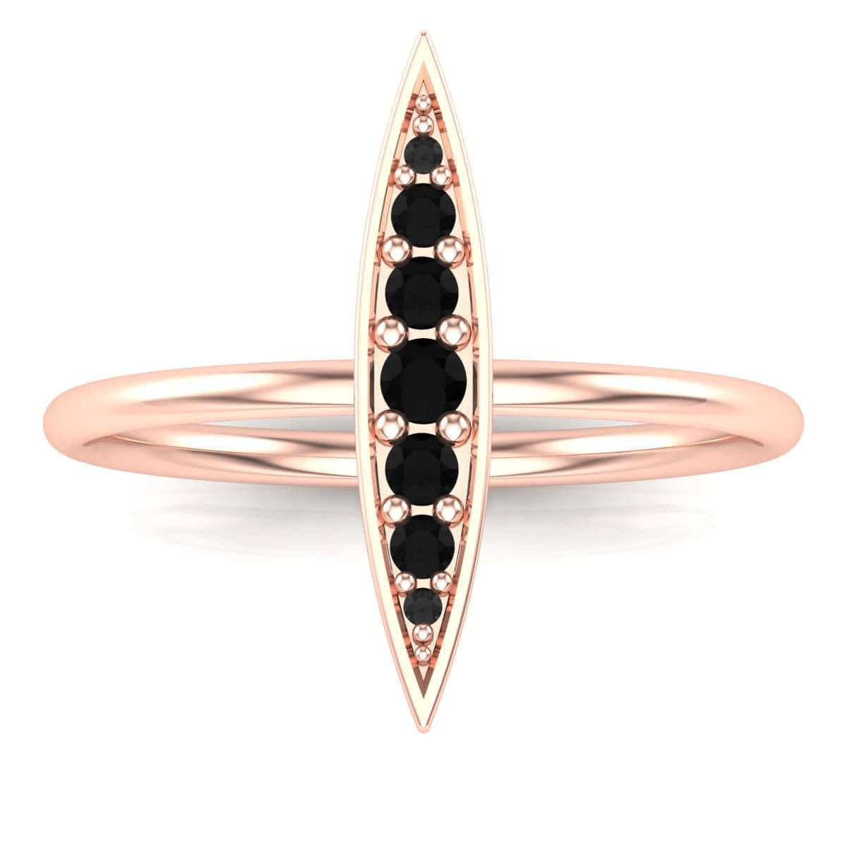 Elegant gold Rice Ring with black gemstones.