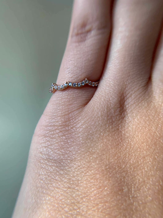 Elegant Three Peak Ring on finger with delicate design.