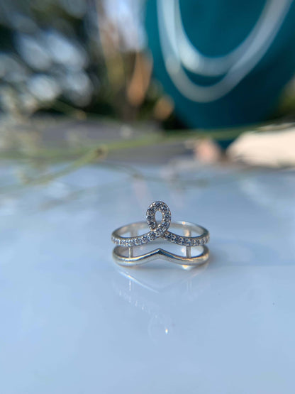 Crown Ring with sparkling design on white background.