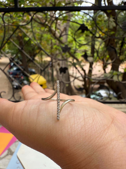 Inferno Ring displayed on a hand in an outdoor setting.