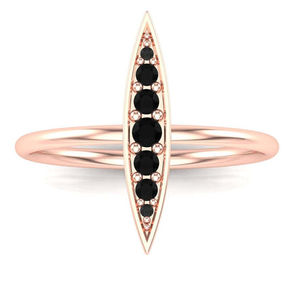 Elegant gold Rice Ring with black gemstones.